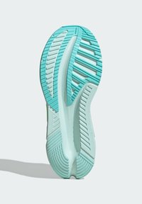 Hardloopschoen zool in licht muntgroen met gestructureerde, multi-directionele groeven voor grip. Heeft een gladde, gebogen structuur voor flexibiliteit.