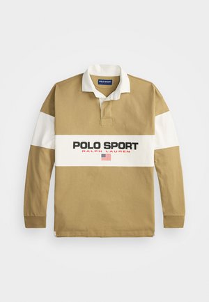 Long-sleeve polo shirt in tan and white cotton, featuring a collared neck, front placket, and bold "POLO SPORT" logo with American flag accent.