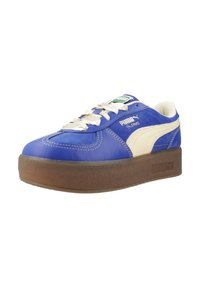 Tenisi din piele albastră cu accente ivorii, talpă groasă din cauciuc maro și sireturi albe. Logo-ul Puma și brandingul "Palermo" pe lateral.