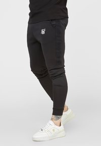 SIKSILK Träningsbyxor - black