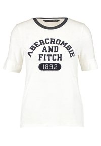 Bílý tričko s krátkými rukávy, kulatým výstřihem, černým lemem a tučným textem: "ABERCROMBIE A FITCH 1892" černými písmeny. Měkká látka.