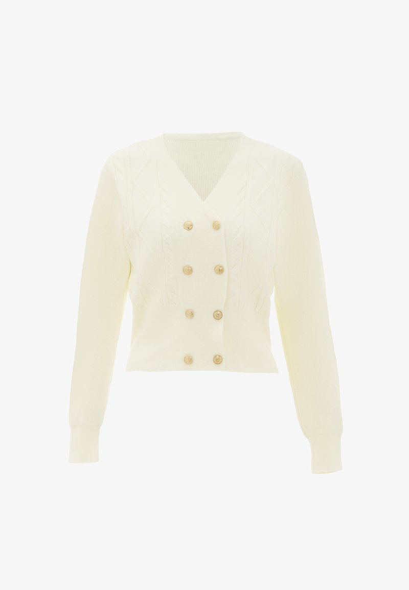 Krém színű, rövidített kardigán, V nyakkivágással, fonott mintával és hat aranyszínű gombbal az elején. Hosszú ujjú.