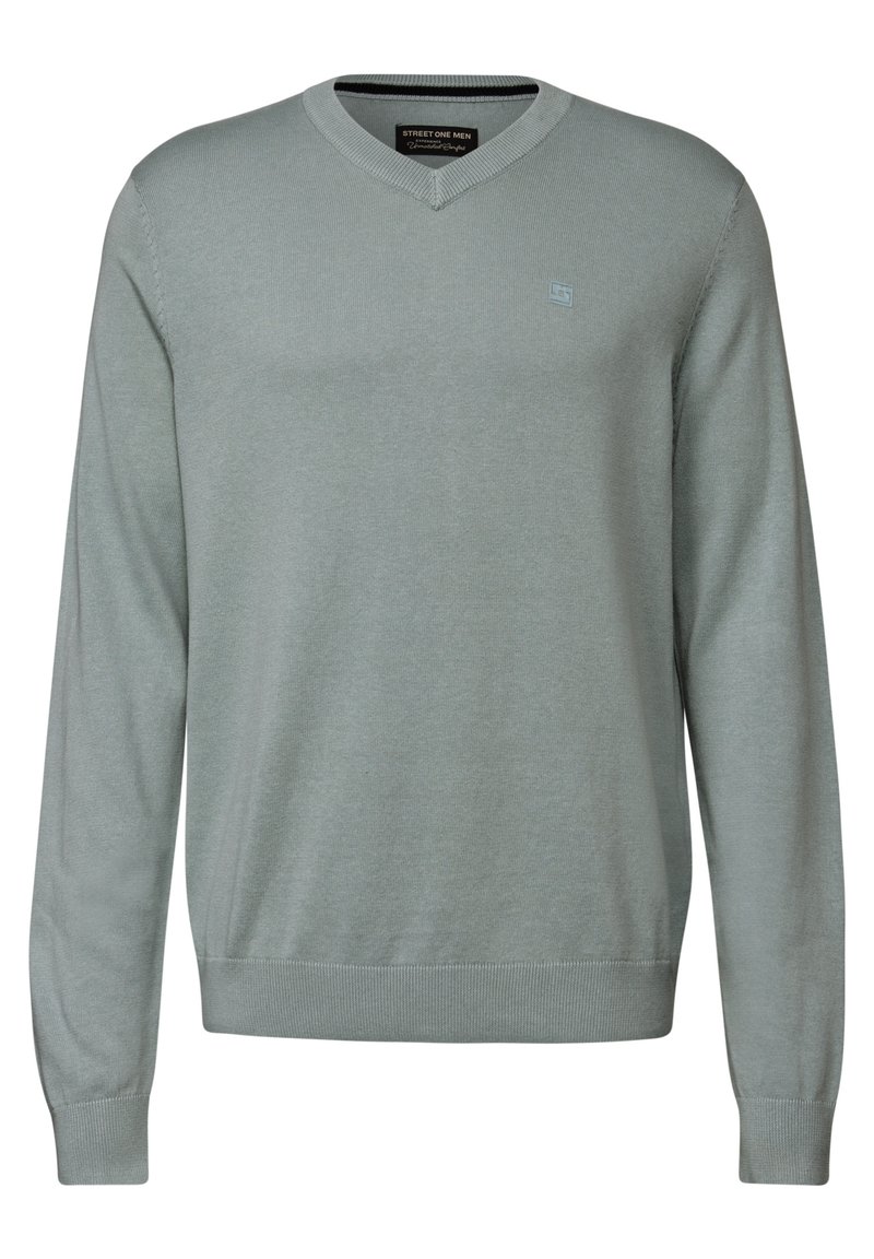 V-ringad tröja i ljusgrön, tillverkad av mjukt stickat material. Har långa ärmar, ribbade cuffs och en liten logotyp på bröstet.