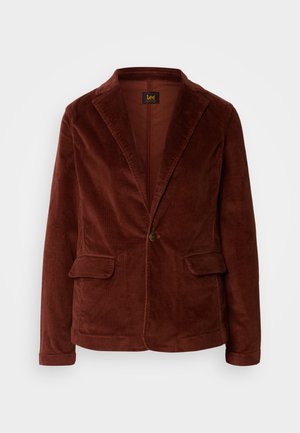 Kordfløyelblazer i mørk rust, med slagkrage, to frontlommer, enkelt knappelukking og teksturert stoff.