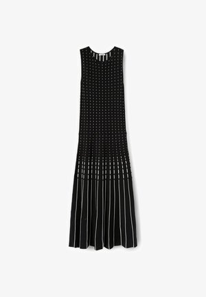 Abito nero senza maniche in maglia con righe bianche verticali, aderente nella parte superiore e gonna svasata a pieghe nella parte inferiore.