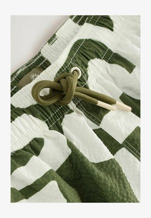 Șorturi de baie cu un model verde și alb, realizate dintr-un material texturat, cu talie elastică și șnur reglabil cu vârfuri bej.