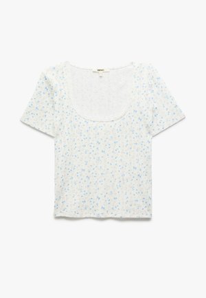 Camicia a maniche corte con motivo floreale e scollatura quadrata. Realizzata in tessuto leggero, presenta fiori blu su sfondo bianco.
