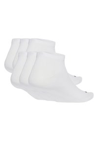 Calcetines de algodón blancos hasta el tobillo en un set de cuatro, con una textura suave, puntera reforzada y un puño acanalado para un ajuste seguro.