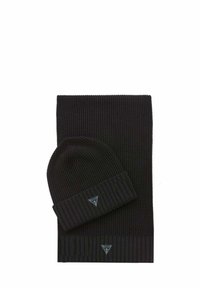 Set composto da cuffia e sciarpa in maglia nera. La cuffia presenta una texture a coste con un risvolto piegato. Entrambi gli articoli sono decorati con una piccola toppa con logo.