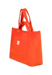 Sac fourre-tout en tissu doux orange vif avec poche avant et double poignée, debout sur un fond blanc.