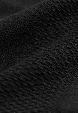 Black knitted fabric displaying a textured pattern with interwoven threads, featuring a soft, warm appearance.