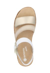 Cork-soled sandal with a white base and metallic gold accent straps. Features soft footbed and adjustable buckle for comfort.