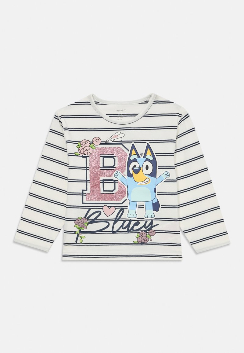 Baliniai dryžuoti marškiniai su ilgomis rankovėmis, balti ir tamsiai mėlyni, su mėlynu animaciniu šunimi, gėlių akcentais ir blizgančia raide "B".