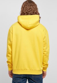 Karl Kani Felpa con cappuccio - yellow