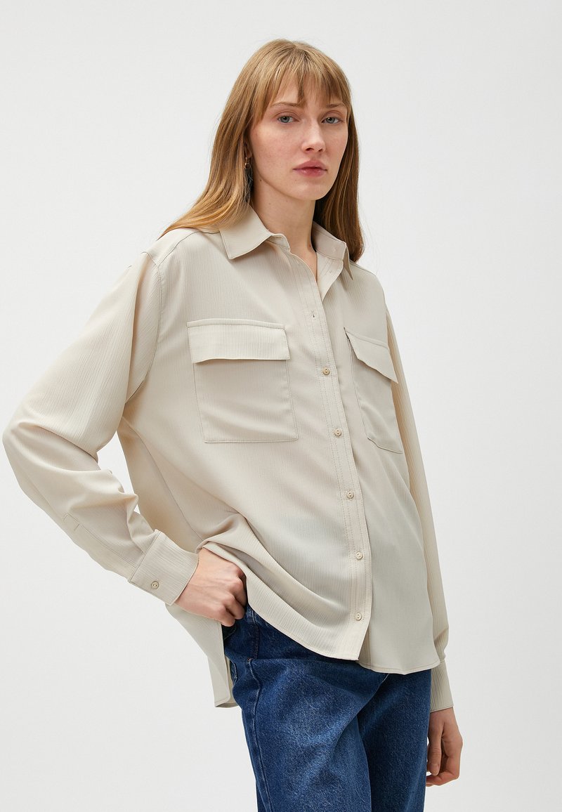 Sneaker calzino da donna beige-platino