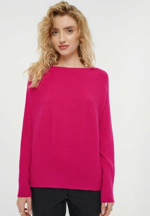 Fuchsia ribbed sweater with a wide boat neckline and long sleeves, featuring a relaxed fit and soft texture. Pairing with black pants.