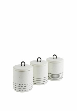 Three white ceramic kitchen storage jars with black loop handles and different black patterned lines near the base arranged in a row.
