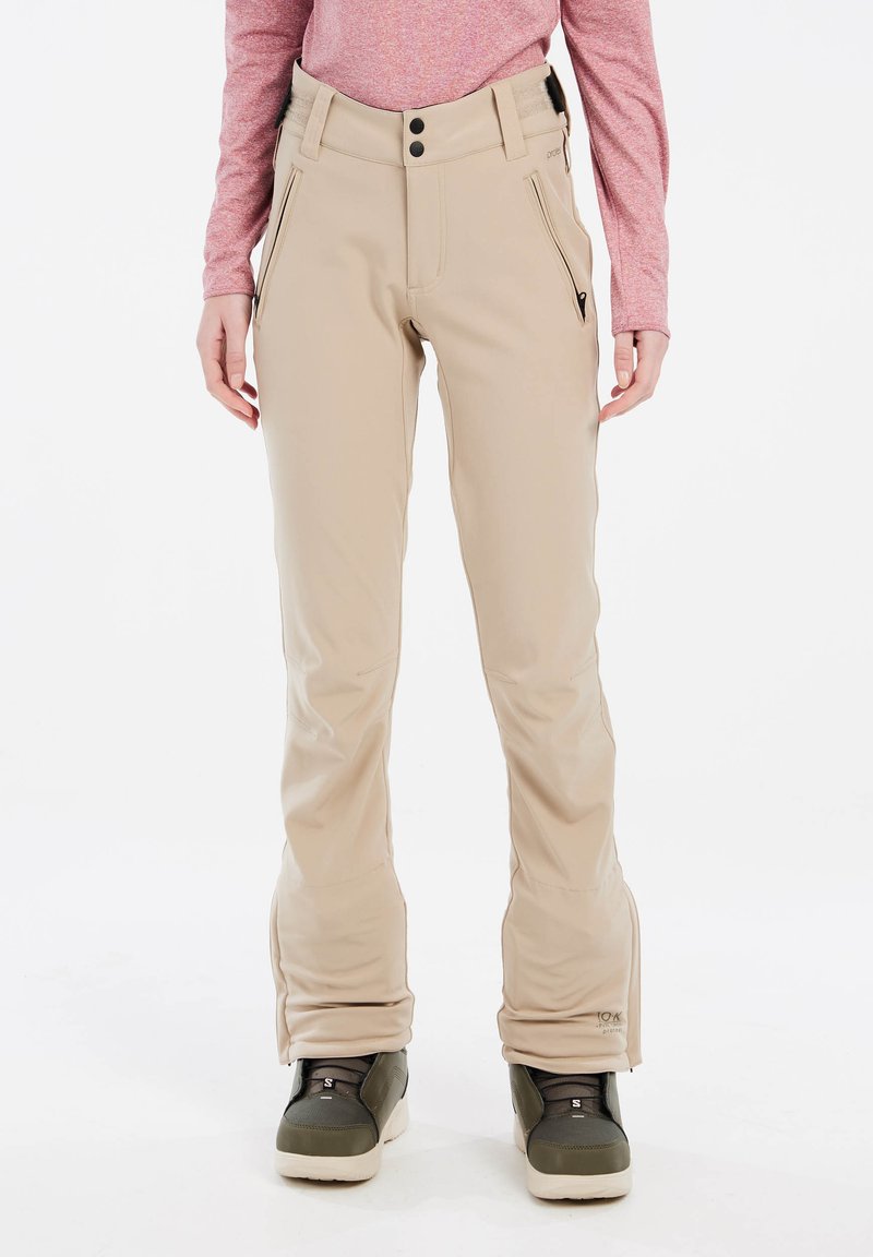 Beige Schneehosen aus dehnbarem Material, mit Reißverschlusstaschen an den Seiten, glatter Textur und figurbetonter Passform an Taille und Beinen.