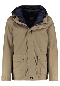 Beżowa wodoodporna kurtka z odpinanym kapturem, zamkiem błyskawicznym, zatrzaskami, dwoma przednimi kieszeniami i ciemnoniebieską podszewką.