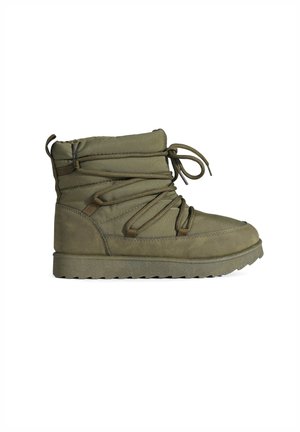 Olive green ankle boot made of fabric, featuring a padded upper, lacing system, and textured rubber sole with a zigzag pattern.
