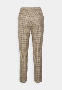 Beige ternede bukser med elastisk talje, lige bendesign og to baglommer. Stoffet har et ternet mønster.