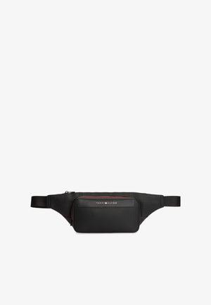 Black nylon fanny pack with a main zippered compartment and a smaller front pocket. Features red accent stitching and a logo. Adjustable waistband.