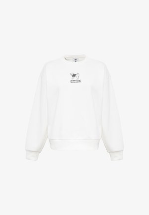 Weiße Sweatshirt mit Rundhalsausschnitt, langen Ärmeln und gerippten Bündchen. Mit einem schwarzen Grafikmotiv eines Hundes und Text in der Mitte.