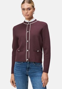 Burgundy cardigan with a high neckline, white trim, and silver buttons. Features two front pockets and a fitted design. Textured fabric.