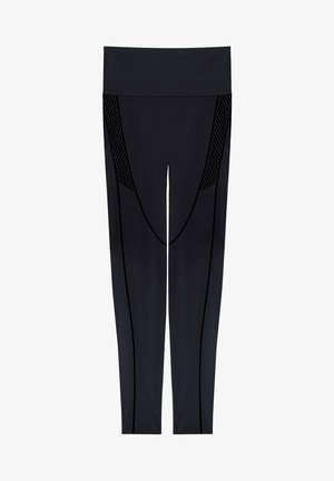 Zwarte high-waisted sportleggings met verticale en diagonale naaddetails langs de benen en heupen, vooraanzicht.