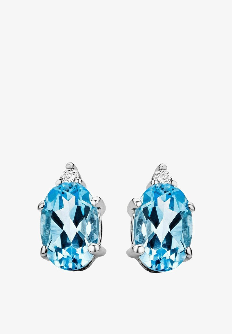 Modre ovalne uhane z poliranim srebrnim nastavljanjem, ki vsebujejo tri majhne prozorne akcentne kamne nad vsakim draguljem, ki poudarjajo njihovo sijajnost.