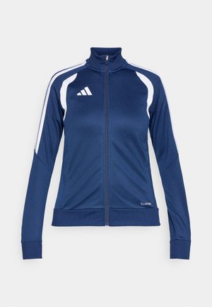 Marineblaue Sportjacke mit hohem Kragen, durchgehendem Reißverschluss, weißen Seitenstreifen und Adidas-Logo auf der Brust, hergestellt aus einem glatten, dehnbaren Material.