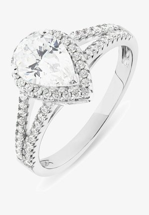 Silver ring featuring a pear-shaped clear gemstone, surrounded by small diamonds along a split-shank band. High-polish finish.