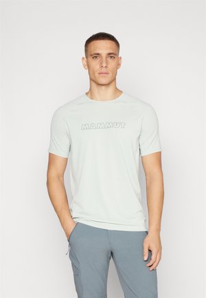 Light grey short-sleeve T-shirt with "MAMMUT" logo in darker grey, made of a smooth, breathable fabric. Features a round neckline and raglan sleeves.