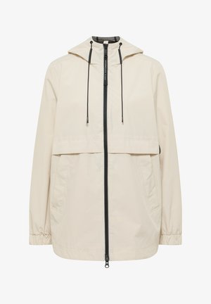 Veste beige à capuche avec fermeture éclair noire sur le devant, cordons de serrage réglables, poignets élastiques et deux poches latérales, conçue pour une utilisation en extérieur.