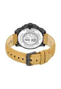 Orologio in acciaio inossidabile nero con cinturino in suede beige, caratterizzato da una cassa rotonda, un quadrante circolare e il logo Timberland inciso sul retro.