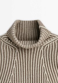 Brown and cream striped knitted sweater with a high collar. Features textured ribbing and a wavy pattern down the front.