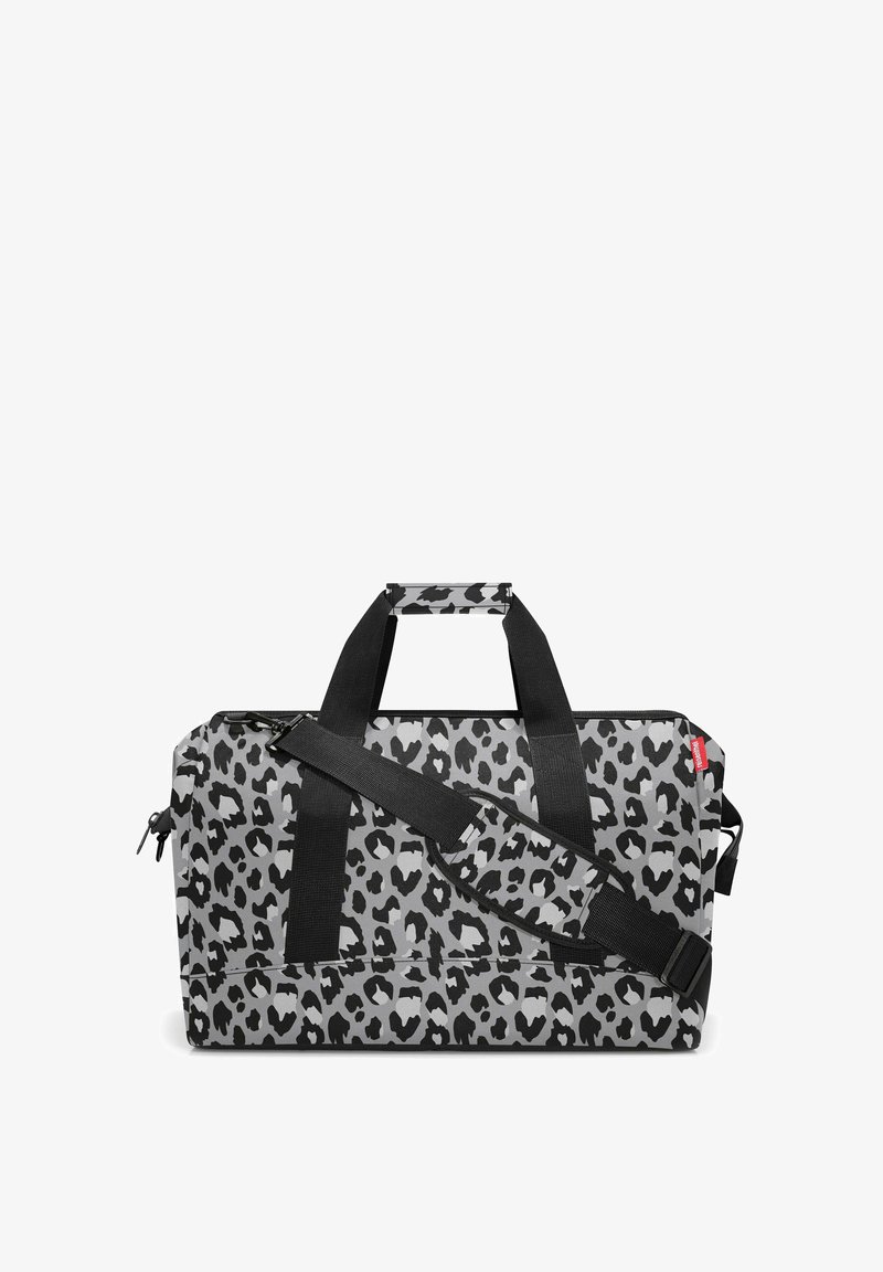 Duffle bag in gray and black leopard print, made of durable material, featuring dual carrying handles and an adjustable shoulder strap.