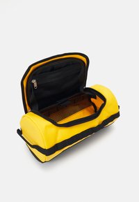 The North Face TRAVEL CANISTER  - Geantă cosmetice - gold-coloured/black