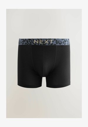 Boxers noirs avec une ceinture en imprimé léopard gris et bleu, arborant le nom de la marque "NEXT" en lettres dorées. Texture de tissu lisse.