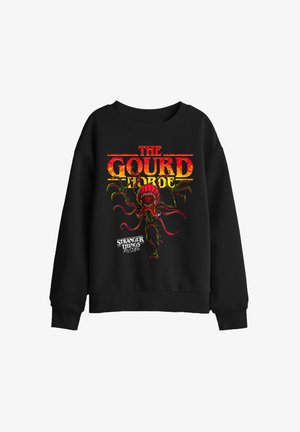 Black sweatshirt with red and yellow "The Gourd Horde" text and a monstrous plant graphic from Stranger Things Tales from the Loop series.