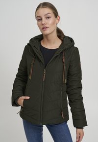 Khaki puffer jacket with a hood, featuring vertical stitching, a front zipper, and drawstring accents. Brown leather tags and zipper pulls.
