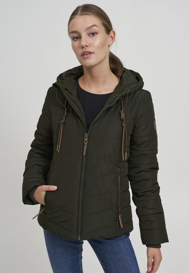 Khaki puffer jacket with a hood, featuring vertical stitching, a front zipper, and drawstring accents. Brown leather tags and zipper pulls.