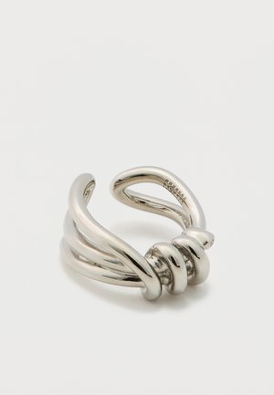 Adjustable silver-tone metal ring featuring twisting strands and a knotted design, polished finish with smooth surfaces and curves.