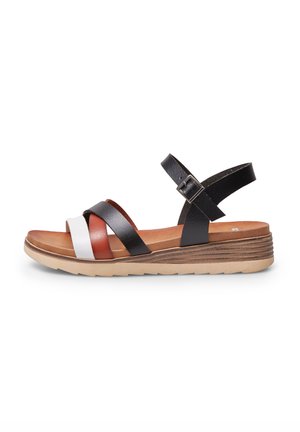 Sandali con cinturini caratterizzati da bande in pelle nere, bianche e marroni, una soletta imbottita marrone e una suola in gomma tabacco con design a strati.