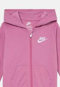 Nike Sportswear BABY COVERALL UNISEX - Kombinezonas - magic flamingo