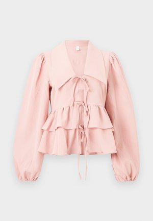 Light pink blouse with large collar, long puffed sleeves, layered ruffle hem, and three front tie closures.