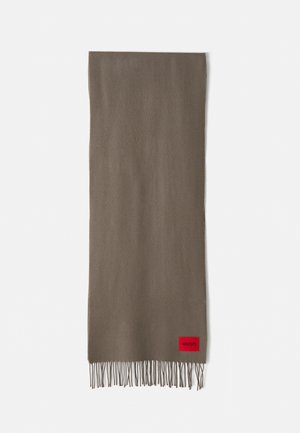Brown scarf with a soft texture, featuring fringed edges and a red logo patch labeled "HUGO" on one end.