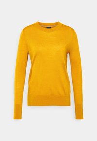 Maglione giallo a maniche lunghe realizzato in morbido tessuto a maglia leggera, con scollatura rotonda e una vestibilità aderente all'orlo e ai polsini.