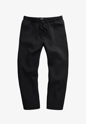 Schwarze Sweatpants aus weichem Stoff, mit einem Kordelzugbund, seitlichen Taschen und einem schmal zulaufenden Bein Design.