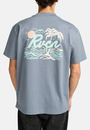 Light blue cotton T-shirt featuring a textured graphic of palm trees, waves, and a sun in pastel colors on the back. Short sleeves, relaxed fit.